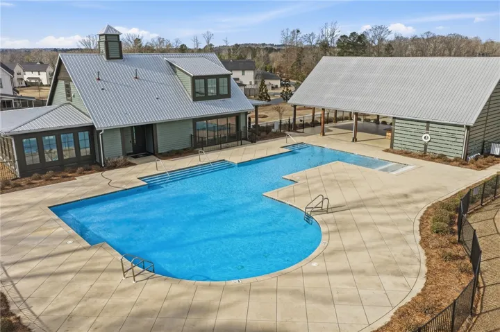 Enjoy outstanding neighborhood amenities with a pool, clubhouse, and covered gathering space designed to bring neighbors together.