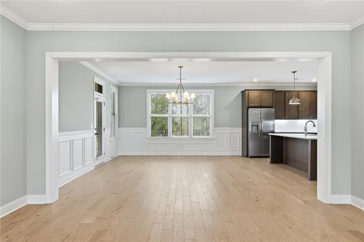 Seamless transitions from living room to kitchen/breakfast room.