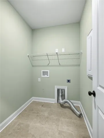 The laundry room is easily accessible from all bedrooms.