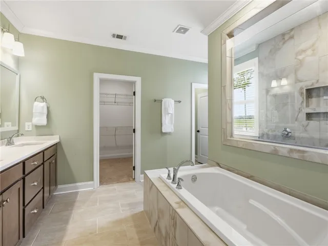 The shower’s distinctive placement beyond the tub adds visual interest.