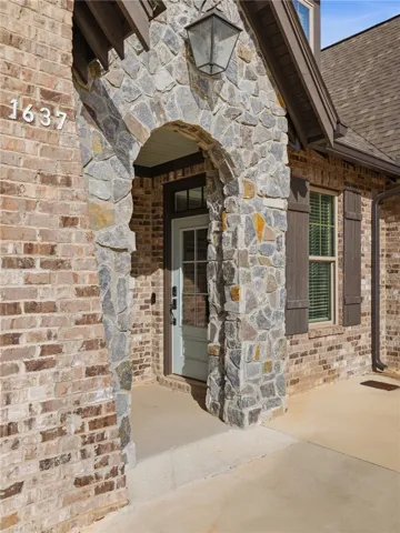 Timeless brick and stone define the exterior.