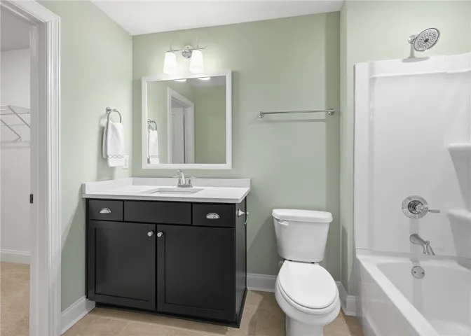 The second-floor bath is well appointed, and a generous walk-in closet adds excellent storage.