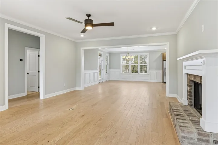 The secondary bedrooms are situated on the left side of the home, offering separation from the primary suite.