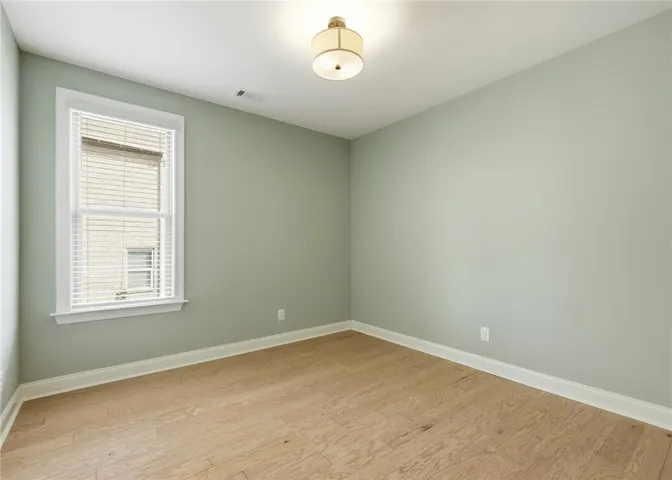 Located within the primary wing is a versatile space ideal for a study, nursery, workout room, or bonus area.