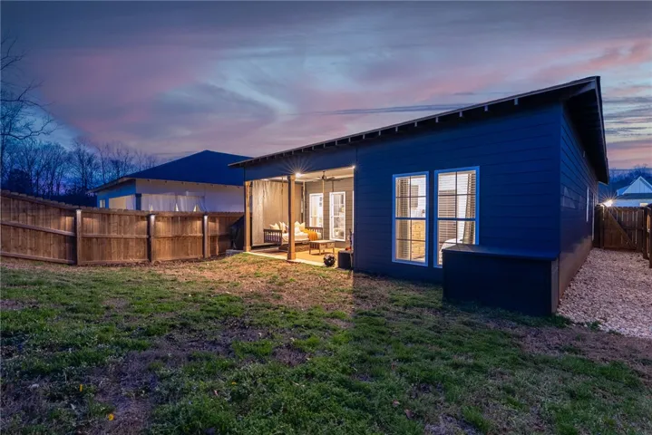 Fully fenced yard with covered back porch
