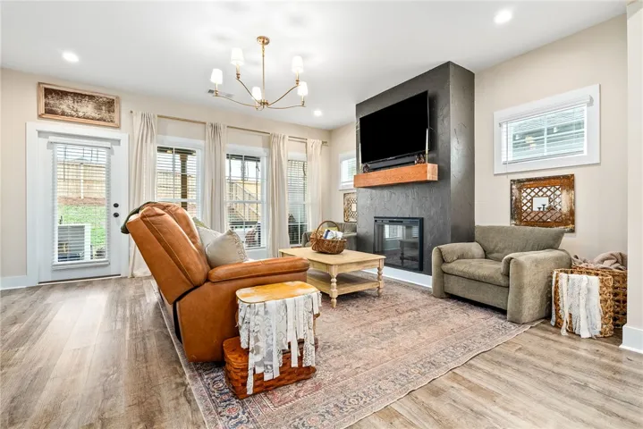 Upgrades in living room include electric fireplace and upgraded lighting