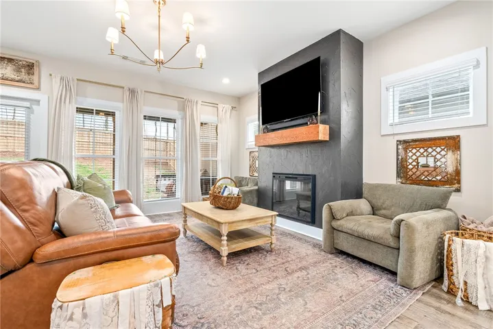 Upgrades in living room include electric fireplace and upgraded lighting