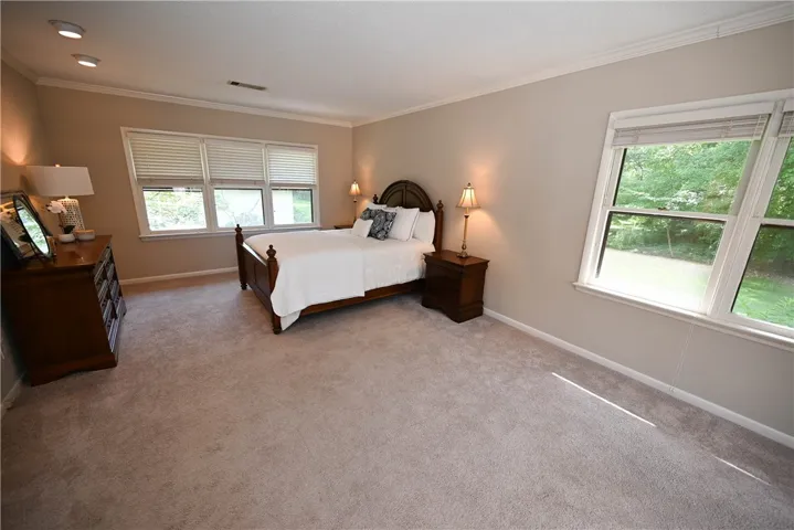 Primary suite filled with windows.