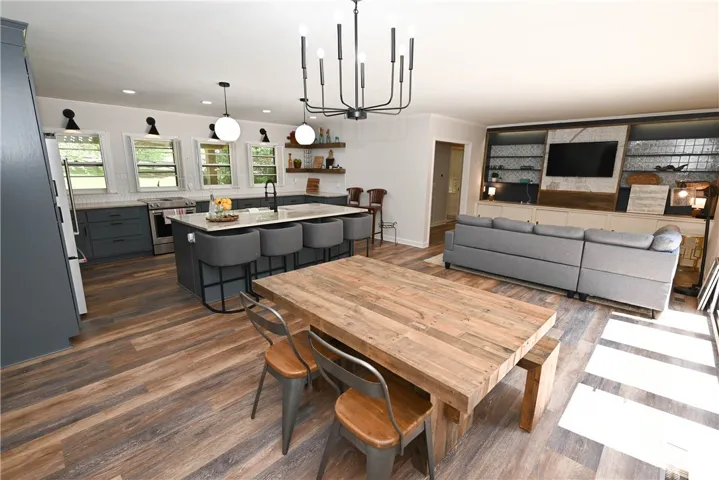 Kitchen overlooks living area and dining room.