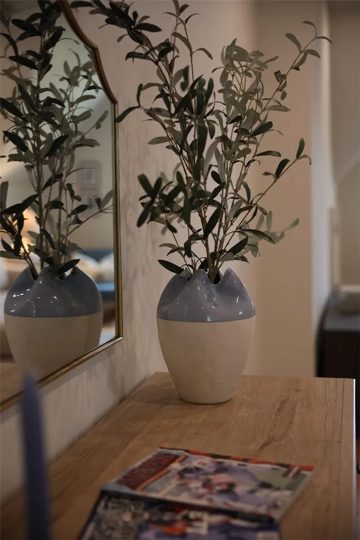 Reflecting elegance, a sleek mirror enhances the interior, offering both style and depth.