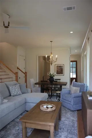An inviting interior seamlessly connects the living and dining areas, fostering an atmosphere for both relaxation and entertaining.