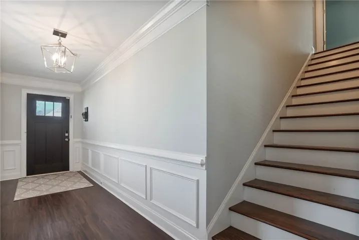Front Foyer hallway and stairs to bonus