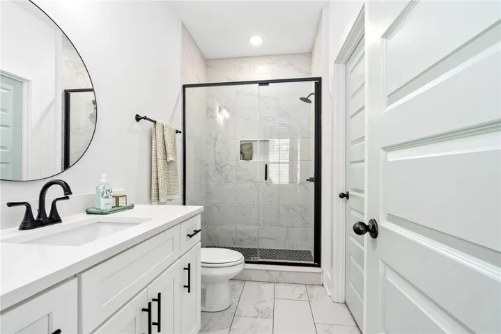 Primary en suite with tiled, walk in shower