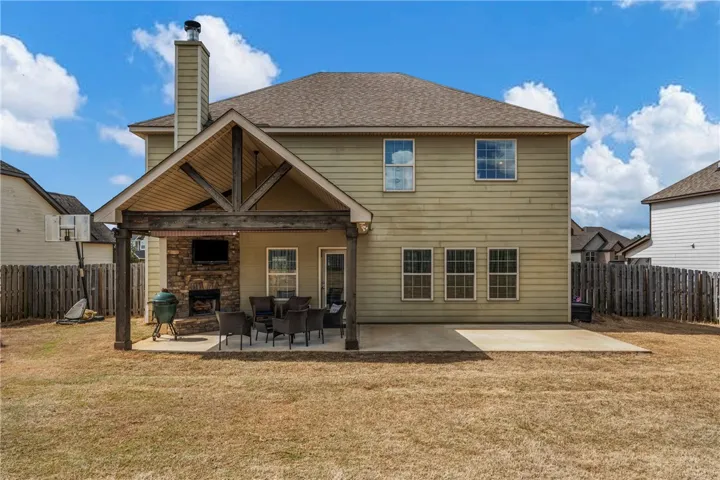 Fabulous flat lot and covered gameday porch with fireplace