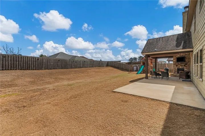 HUGE backyard with extended concrete patio