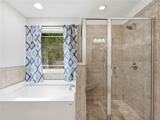 Relax in the deep soaking tub or rejuvenate in the spacious, tiled walk-in shower.