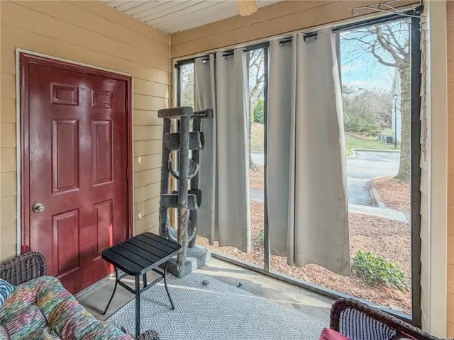 Glass screened front porch area!