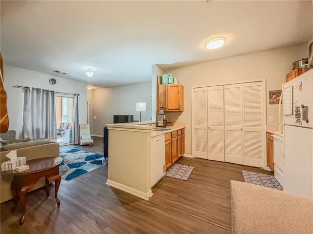 Living room then leads into the kitchen with lots of pantry space!