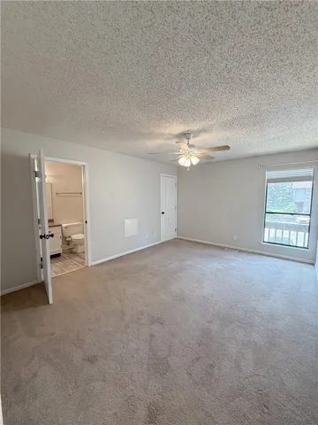 Large, open, primary bedroom upstairs.