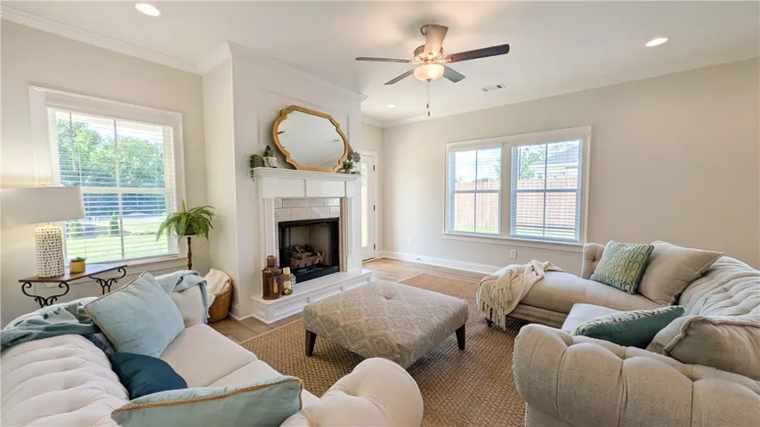 High ceilings and plenty of natural light give this living space an open, airy ambience.