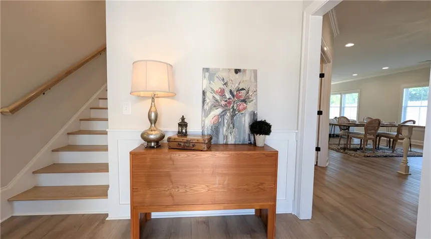 Inviting foyer with open living area in background.