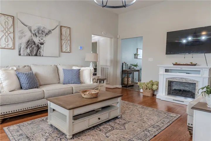 Living room leading into Kitchen area and hallway.