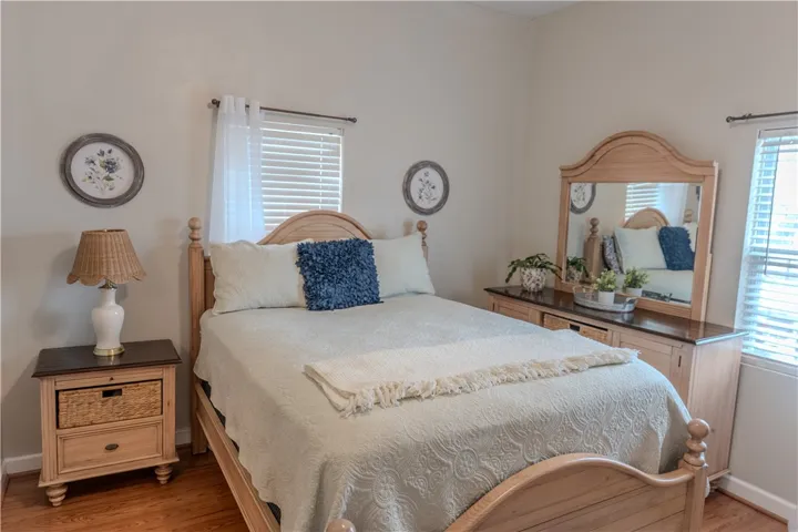 Master bedroom with wood floors.