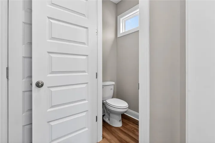 A well-placed window provides abundant light in this private powder room.