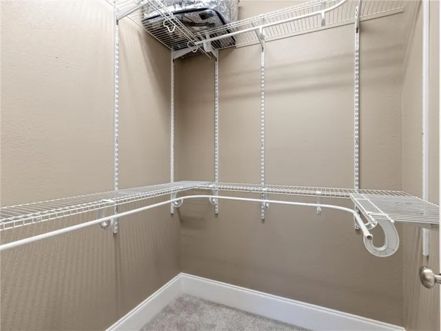 primary closet with extra hanging space