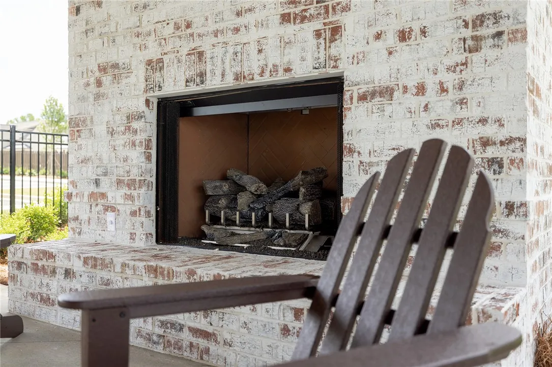 Enjoy cozy evenings by the outdoor fireplace, perfect for relaxation and gathering.