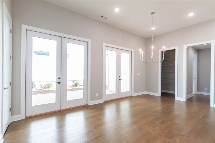 This bright space features gleaming floors and ample natural light, creating an inviting atmosphere.
