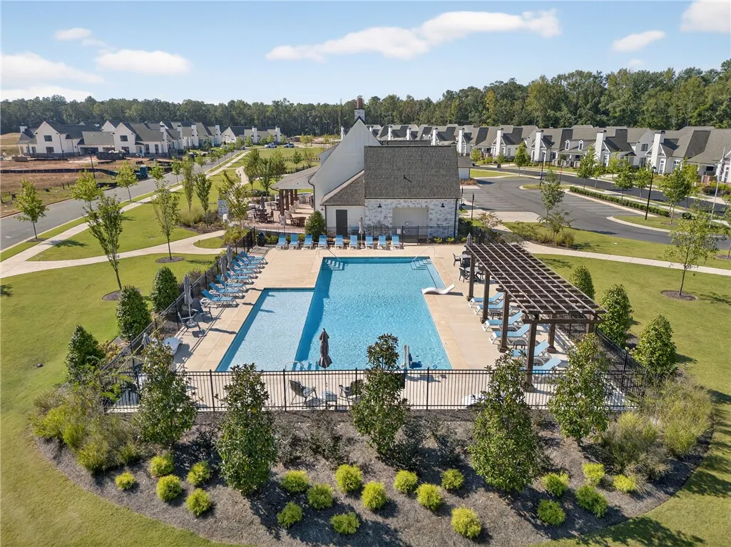 This outdoor pool area offers relaxation and recreation within a community setting.