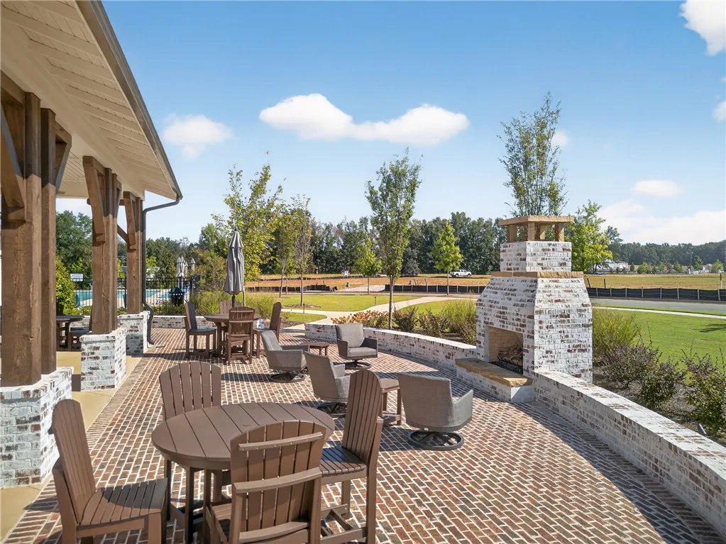 This spacious patio offers an inviting outdoor setting for relaxation and entertainment.