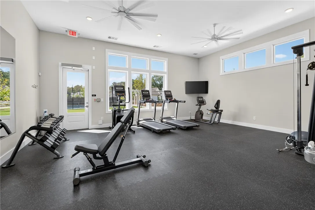 This bright exercise room offers abundant natural light and modern finishes.