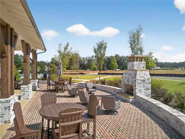 This spacious patio offers an inviting outdoor setting for relaxation and entertainment.