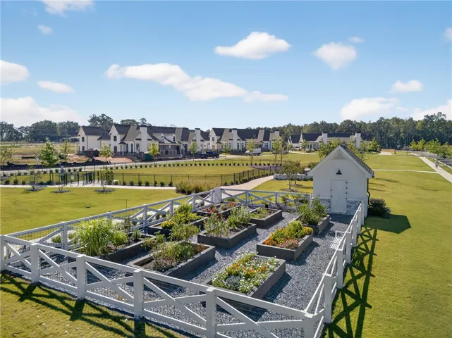 This vibrant community garden, complete with a charming shed, offers a tranquil outdoor escape for residents.