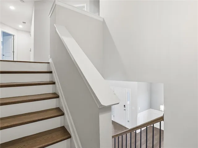 stairs leading to four bedrooms