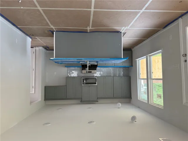 This modern kitchen features sleek cabinetry and convenient built-in appliances.