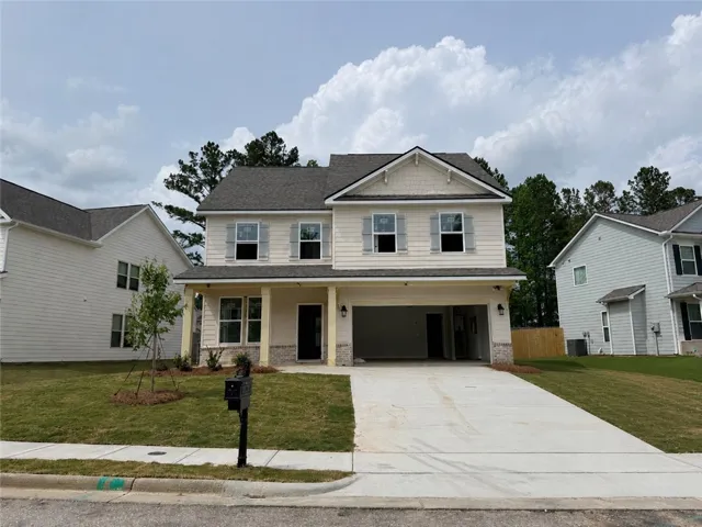 This newly constructed home boasts a spacious two-car garage and inviting curb appeal.