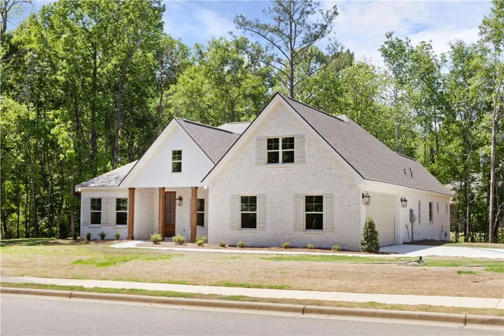 This charming home offers a perfect blend of modern comfort and natural serenity.