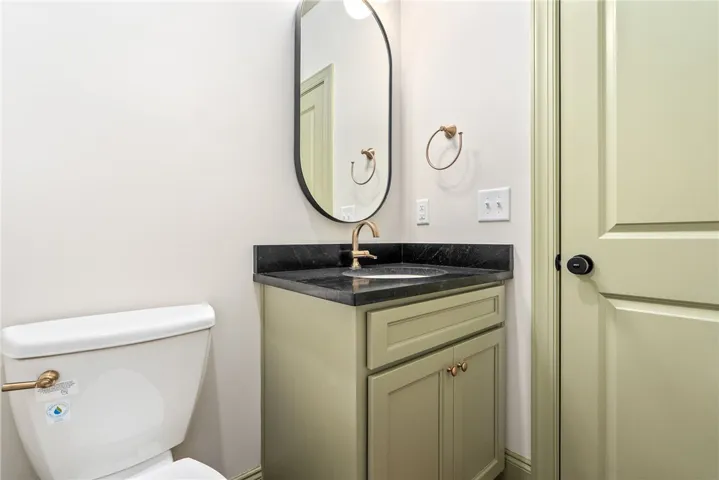 This sleek bathroom features a modern vanity with elegant fixtures.