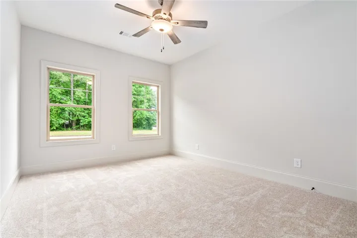 This spacious room offers verdant views and abundant natural light.