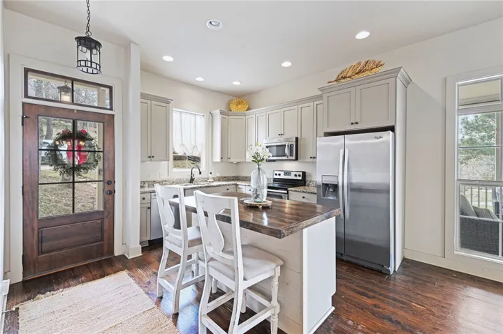 A chef's kitchen with a generous island and sleek appliances for effortless entertaining.