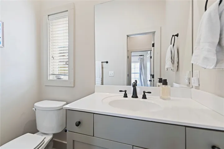 A well-appointed bathroom vanity with a clean white countertop and ample storage beneath.