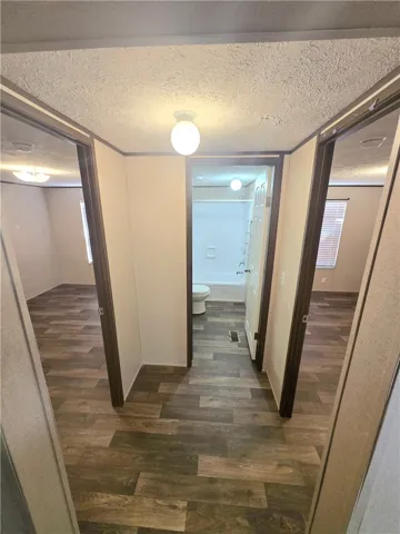 Split floor plan with 3 beds and one bath on one side of the home