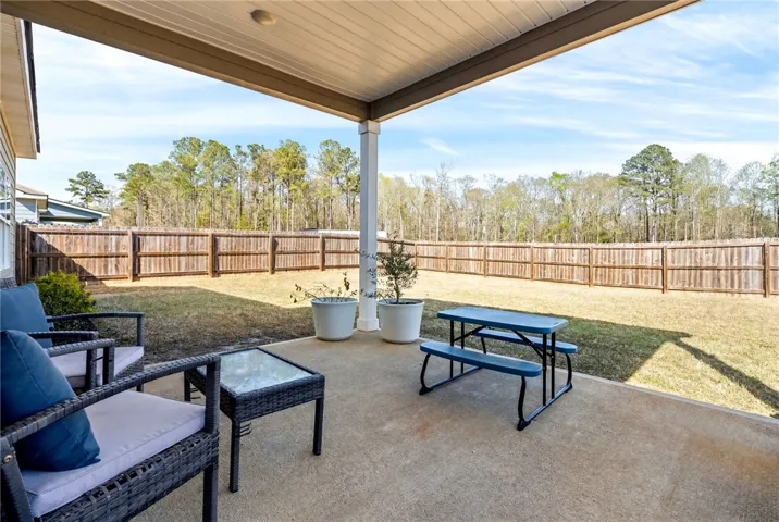 Rear Covered Porch Overlooking the Backyard