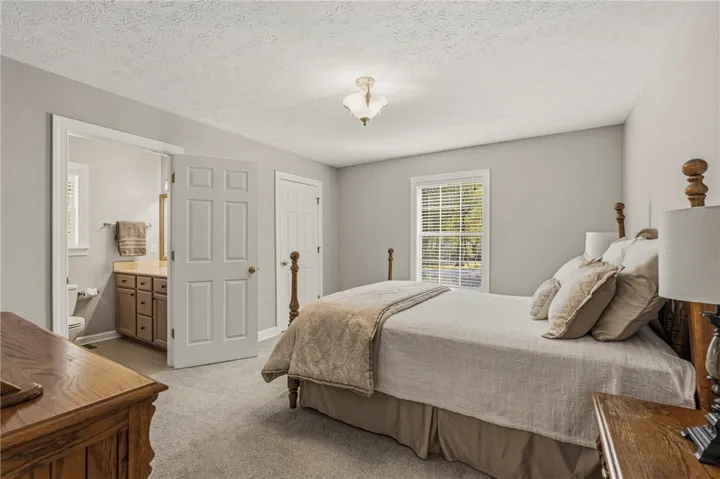 Bedroom 2 is a secondary primary suite &  is spacious with a large built in walk in closet and a private en suite bathroom.