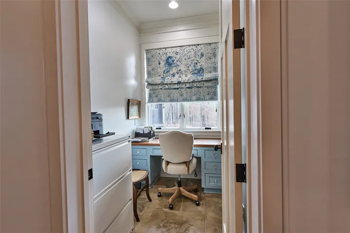 Office with built in desk and shelves