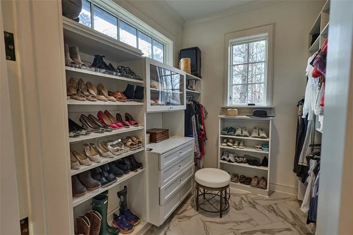Her closet. His closet not shown but all closets are custom designed and built.