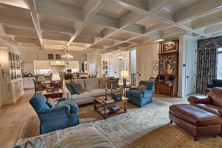 This view from the primary bedroom to the great room and kitchen. Storage closet. Elevator.